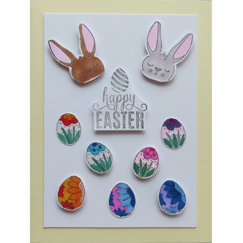 zwei Osterhasenköpfe mit Ostereiern